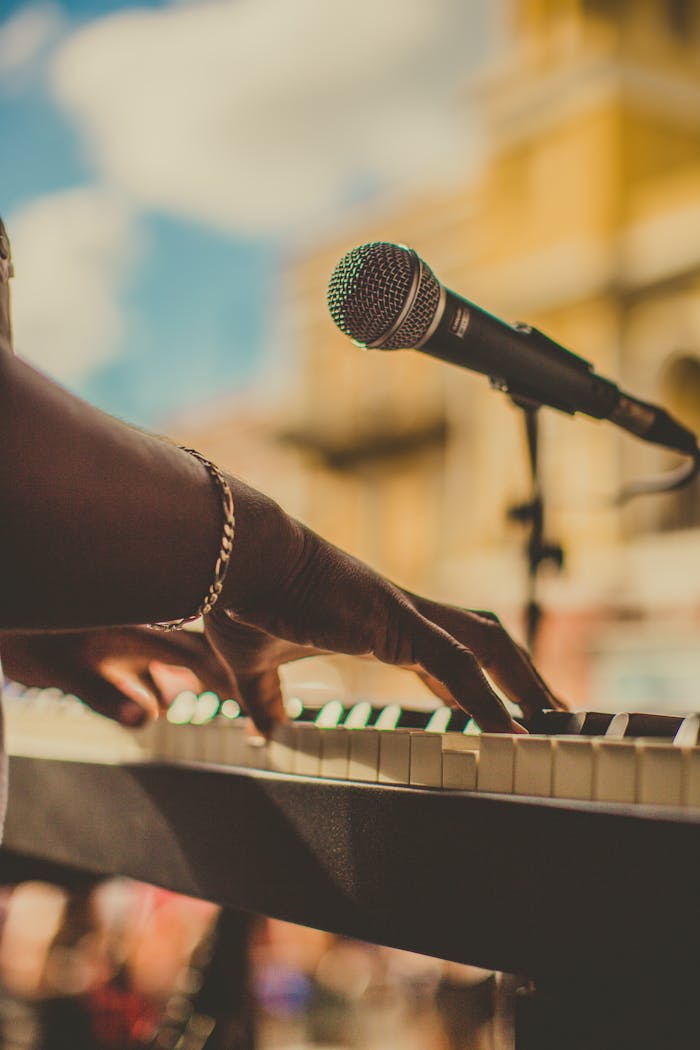 gallery-03 Musician playing piano and singing with a microphone outdoors in San Juan.