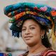 The Art of Drawing Readers In: Your attractive post title goes here Smiling woman in traditional clothing in Antigua, Guatemala.
